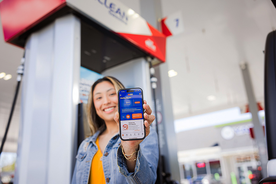 Girl holding phone with ClubCITGO app open