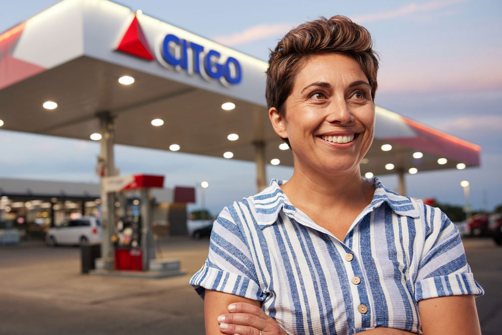 Woman standing in front of CITGO station